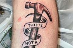 Hammer with a banner that say's 'This is not a drill'